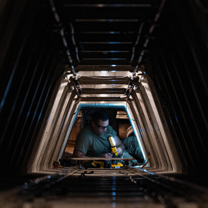 Maintainer performing maintenance checks on an aircraft